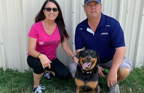Trainers with a dog